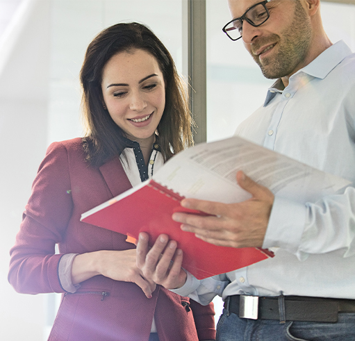 Business People reviewing employee handbook